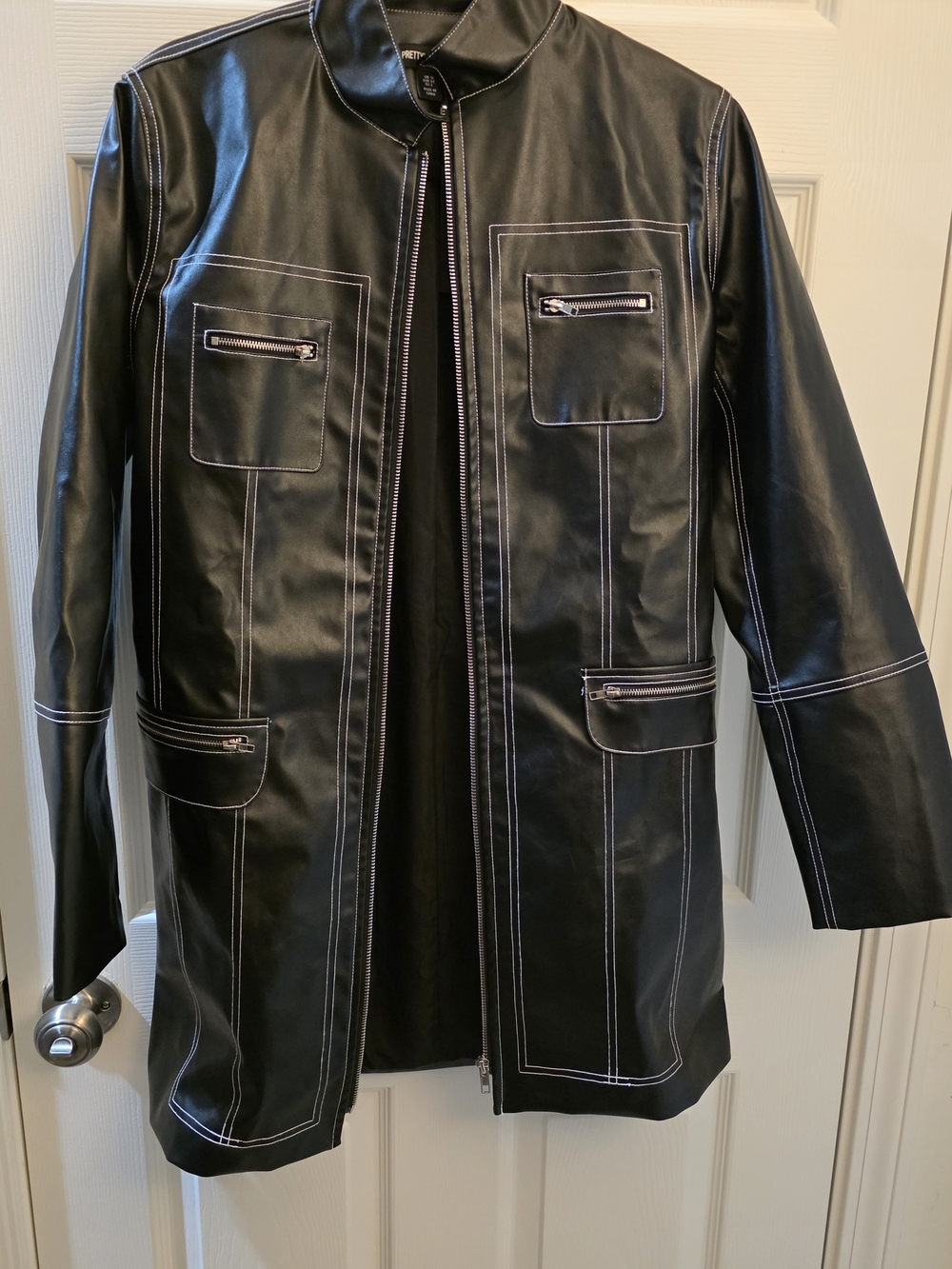 PrettyLittleThing Black Faux Leather Trench Coat with White Stitching